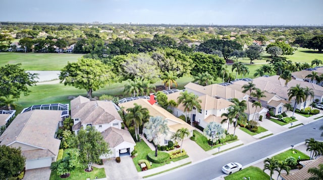 bird's eye view with view of golf course and a residential view