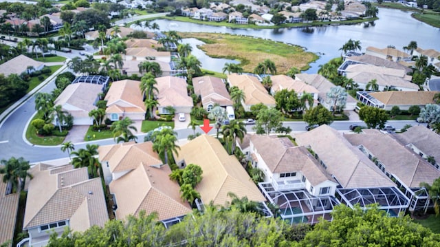 aerial view with a water view and a residential view