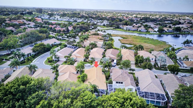 birds eye view of property featuring a water view and a residential view