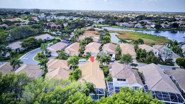 bird's eye view featuring a water view and a residential view