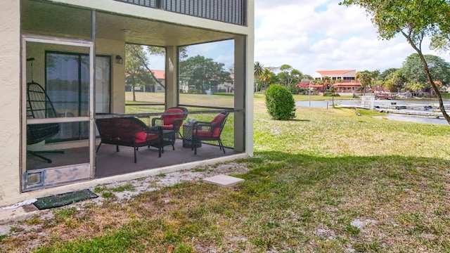 view of yard featuring a patio and a water view