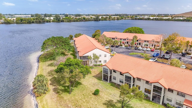 birds eye view of property with a water view