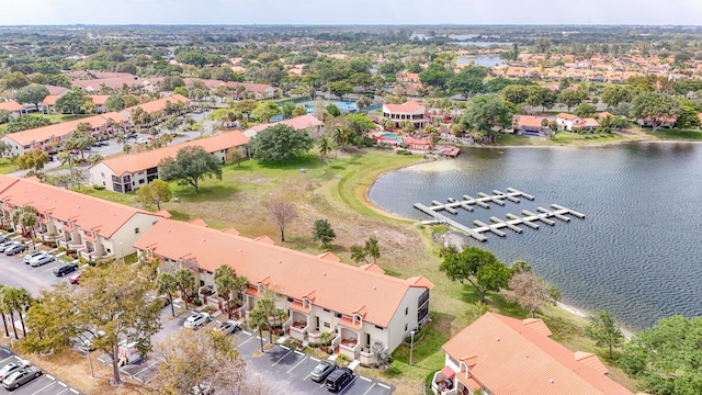 drone / aerial view featuring a residential view and a water view