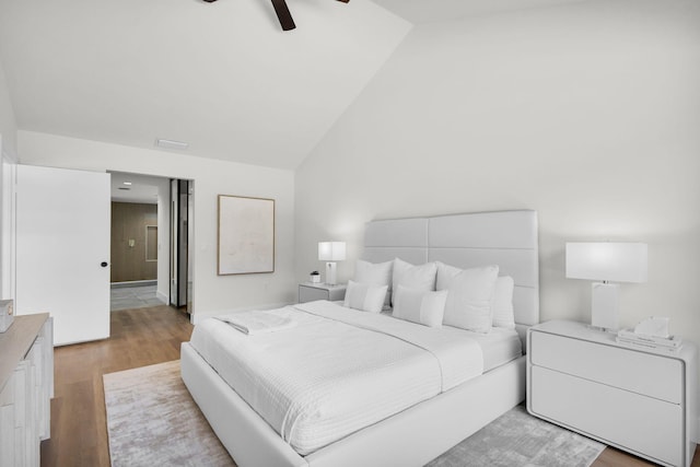 2795 Hawthorne Ln, West Palm Beach, FL 33409 - bedroom featuring vaulted ceiling, wood finished floors, and a ceiling fan