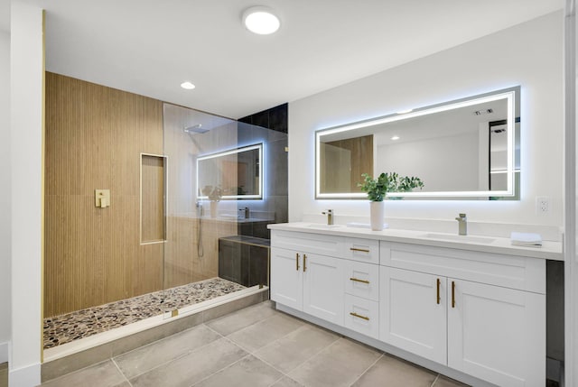 2795 Hawthorne Ln, West Palm Beach, FL 33409 - full bath with walk in shower, tile patterned floors, and double vanity