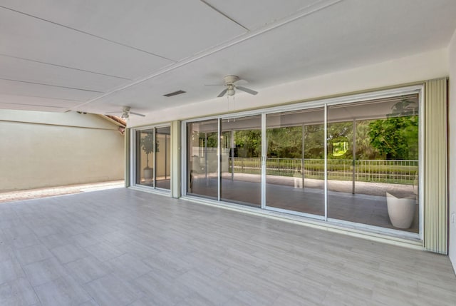 2795 Hawthorne Ln, West Palm Beach, FL 33409 - unfurnished sunroom with a ceiling fan and lofted ceiling