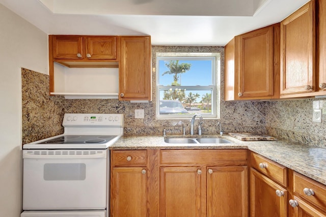 kitchen with white electric range, a sink, decorative backsplash, and open shelves
