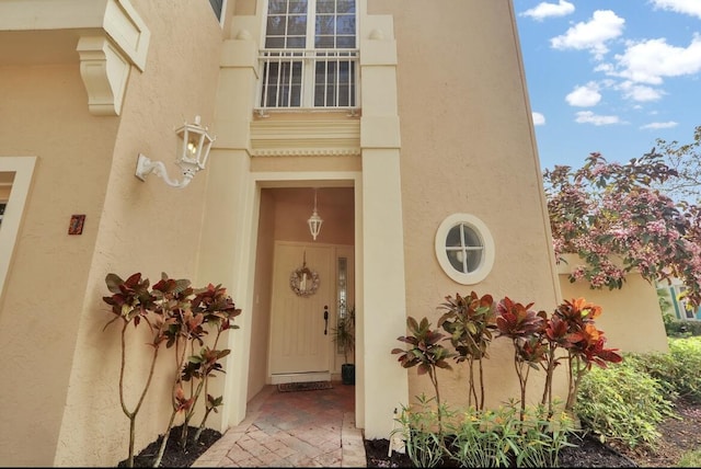 7 Via Tivoli, Palm Beach Gardens, FL 33418 - doorway to property with stucco siding