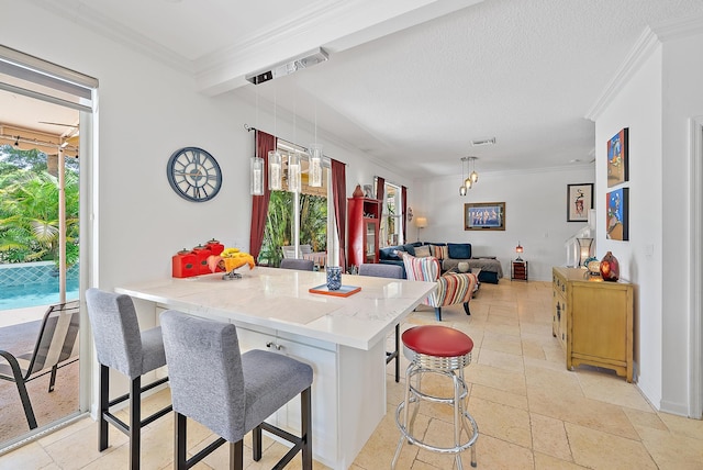 4474 Thornwood Cir, Palm Beach Gardens, FL 33418 - kitchen with a kitchen bar, a peninsula, ornamental molding, decorative light fixtures, and stone tile floors