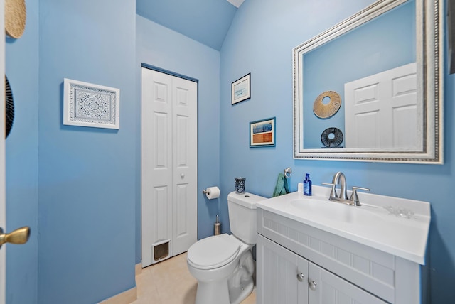 4474 Thornwood Cir, Palm Beach Gardens, FL 33418 - half bathroom featuring tile patterned floors, toilet, vanity, and a closet