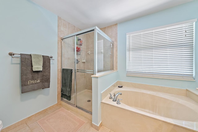 4474 Thornwood Cir, Palm Beach Gardens, FL 33418 - bathroom featuring a stall shower, a garden tub, and tile patterned floors
