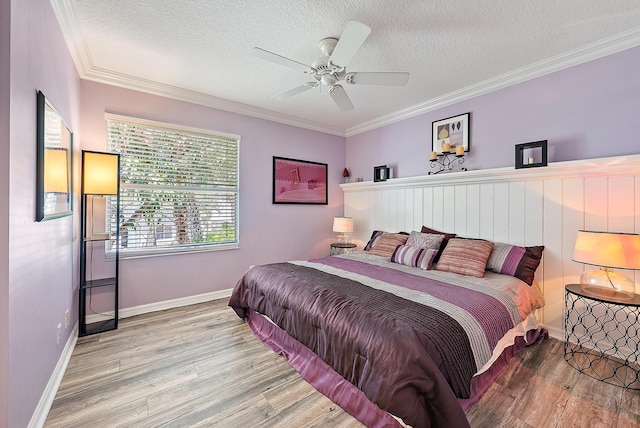 4474 Thornwood Cir, Palm Beach Gardens, FL 33418 - bedroom featuring wood finished floors, a textured ceiling, crown molding, baseboards, and a ceiling fan