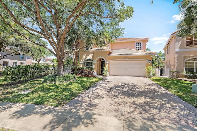 4474 Thornwood Cir, Palm Beach Gardens, FL 33418 - mediterranean / spanish home with stucco siding, an attached garage, decorative driveway, and a tile roof