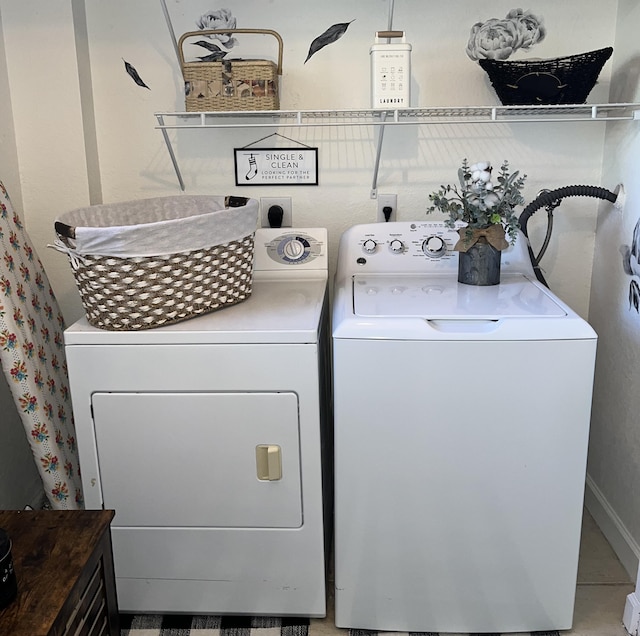 clothes washing area featuring laundry area and washing machine and dryer