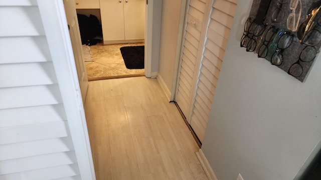 hall with light wood-type flooring