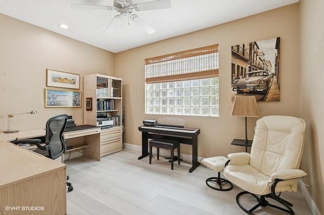 office space featuring ceiling fan, baseboards, recessed lighting, and light wood finished floors