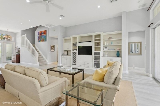 living room with healthy amount of natural light, baseboards, recessed lighting, and ceiling fan