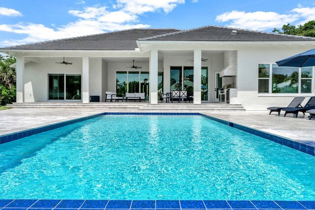 pool featuring a ceiling fan and a patio area