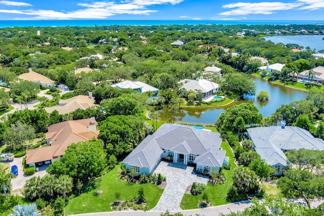drone / aerial view featuring a water view and a residential view