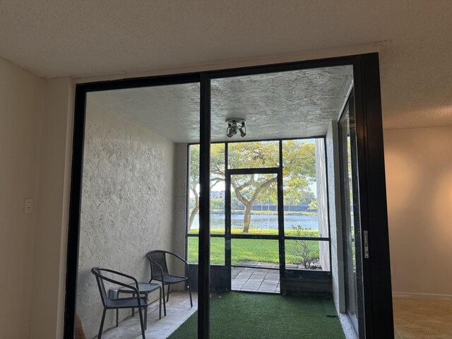 unfurnished sunroom featuring plenty of natural light