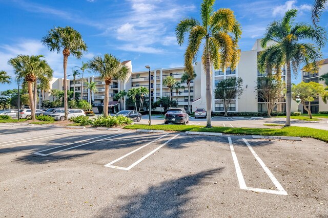 view of building exterior featuring uncovered parking