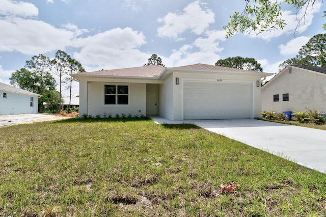 ranch-style home featuring a garage, stucco siding, driveway, and a front lawn