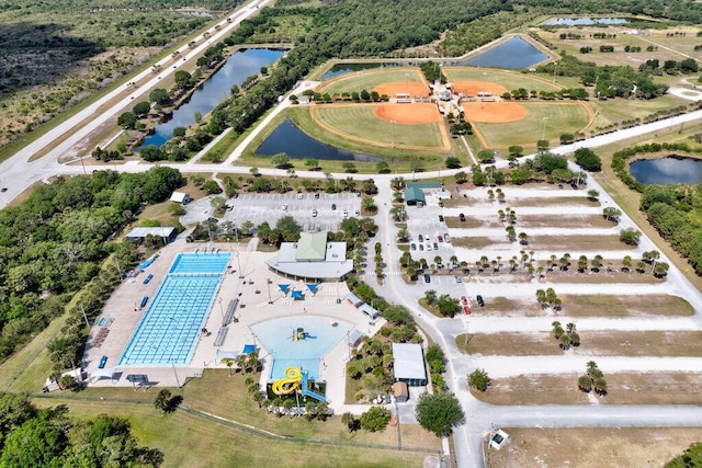 birds eye view of property featuring a water view