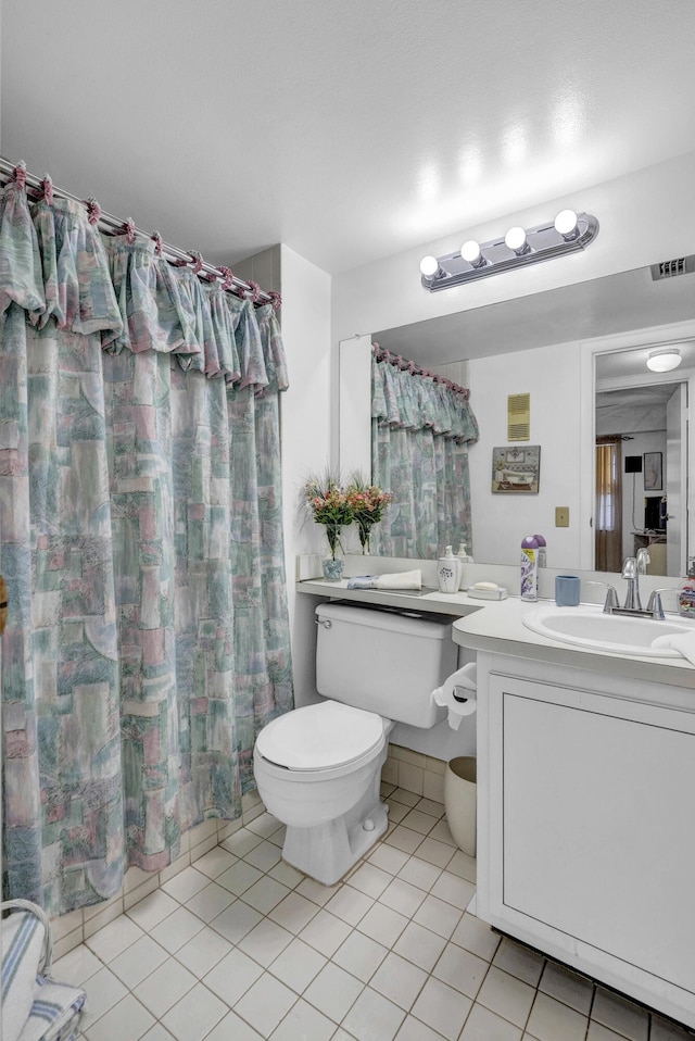 full bathroom featuring visible vents, vanity, curtained shower, toilet, and tile patterned floors