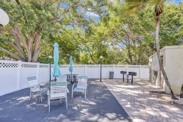 view of patio / terrace featuring fence and outdoor dining space