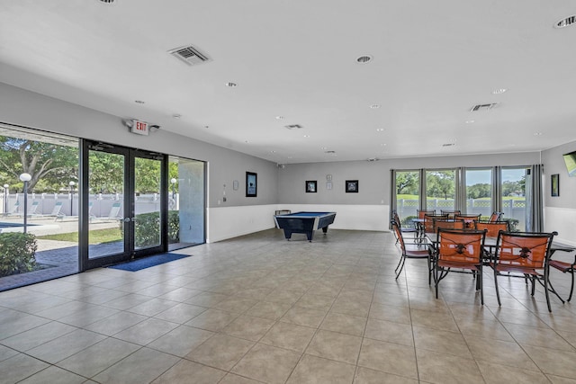 interior space with visible vents, billiards, light tile patterned flooring, and a wealth of natural light