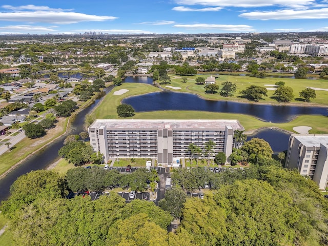 birds eye view of property featuring a water view and golf course view