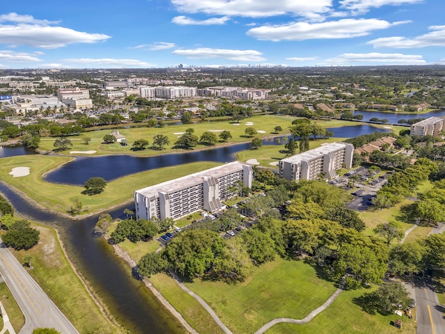 drone / aerial view featuring a water view and golf course view