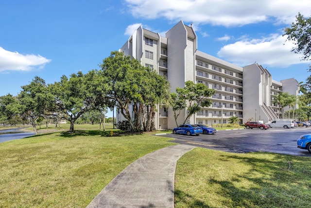view of property with uncovered parking