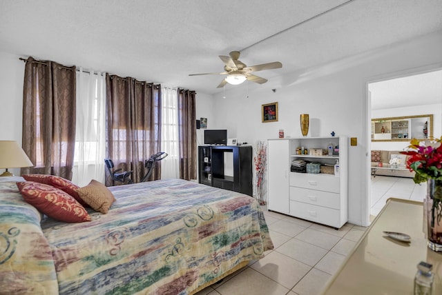 bedroom featuring ceiling fan and light tile patterned flooring