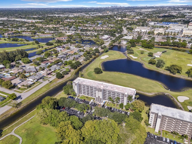 aerial view featuring a water view and view of golf course