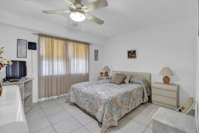 bedroom featuring tile patterned flooring and a ceiling fan