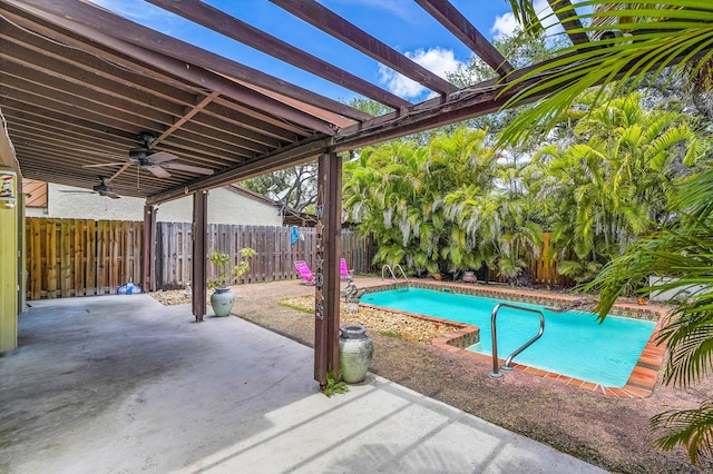 view of swimming pool with ceiling fan, a fenced in pool, a fenced backyard, a patio, and a pergola