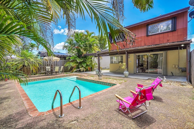 view of pool featuring a patio, a fenced in pool, and a fenced backyard