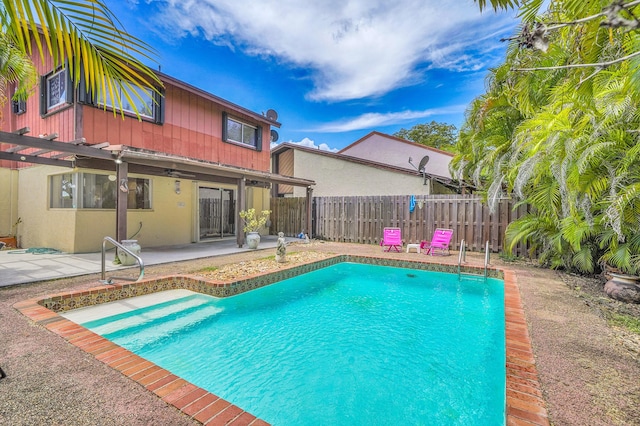 view of pool featuring a pergola, ceiling fan, a fenced in pool, a fenced backyard, and a patio area