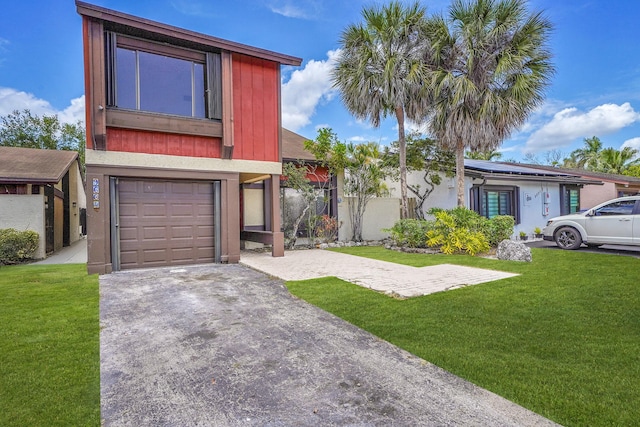 view of front of property with an attached garage, driveway, solar panels, and a front lawn