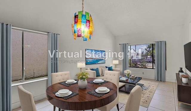 dining area with vaulted ceiling and light tile patterned floors