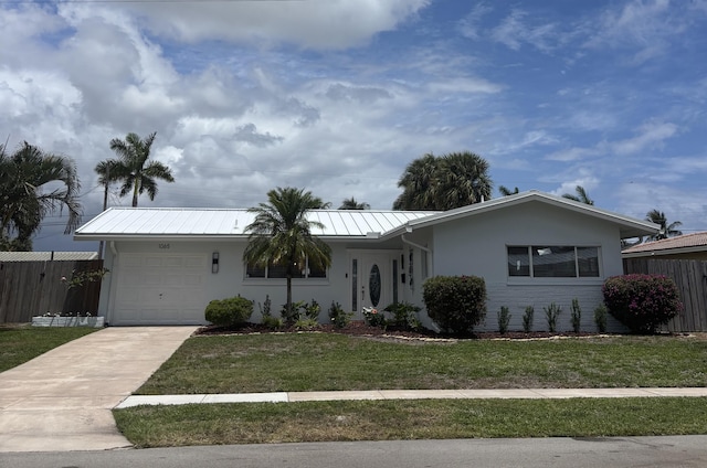 single story home featuring fence, an attached garage, concrete driveway, and stucco siding