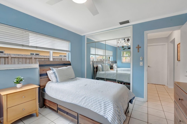 1065 SW 13th St, Boca Raton, FL 33486 - bedroom featuring a ceiling fan, visible vents, light tile patterned floors, and a closet