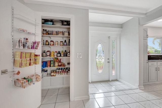 1065 SW 13th St, Boca Raton, FL 33486 - entryway with light tile patterned floors and baseboards