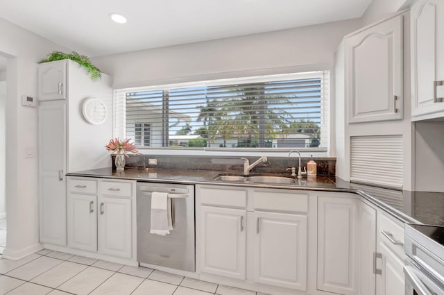 1065 SW 13th St, Boca Raton, FL 33486 - kitchen featuring dishwasher, white cabinets, a sink, dark stone countertops, and light tile patterned floors