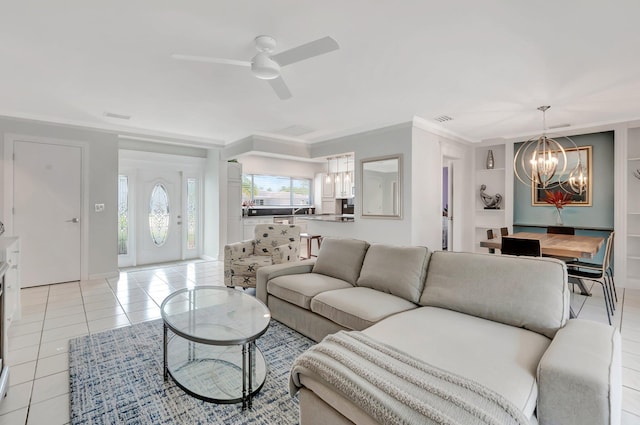 1065 SW 13th St, Boca Raton, FL 33486 - living area with light tile patterned floors, crown molding, ceiling fan with notable chandelier, and visible vents