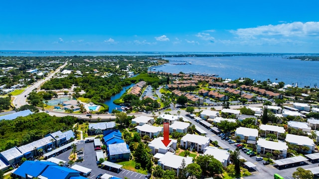 1501 NE 13th Ter Unit H-9, Jensen Beach, FL 34957 - drone / aerial view featuring a water view and a residential view