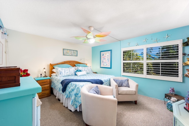 1501 NE 13th Ter Unit H-9, Jensen Beach, FL 34957 - bedroom with a ceiling fan and carpet flooring