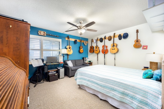 1501 NE 13th Ter Unit H-9, Jensen Beach, FL 34957 - bedroom with carpet floors, a textured ceiling, and ceiling fan