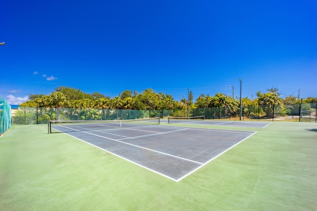 1501 NE 13th Ter Unit H-9, Jensen Beach, FL 34957 - view of tennis court with fence